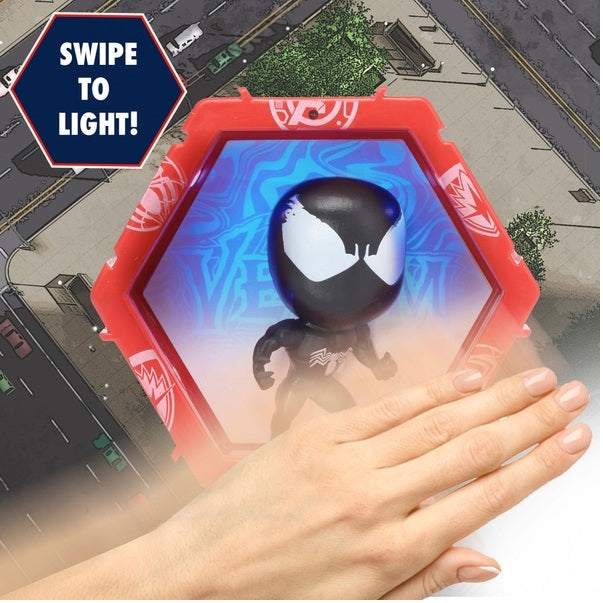 Hand holding a glowing red and blue device with a character inside, on a white background.
